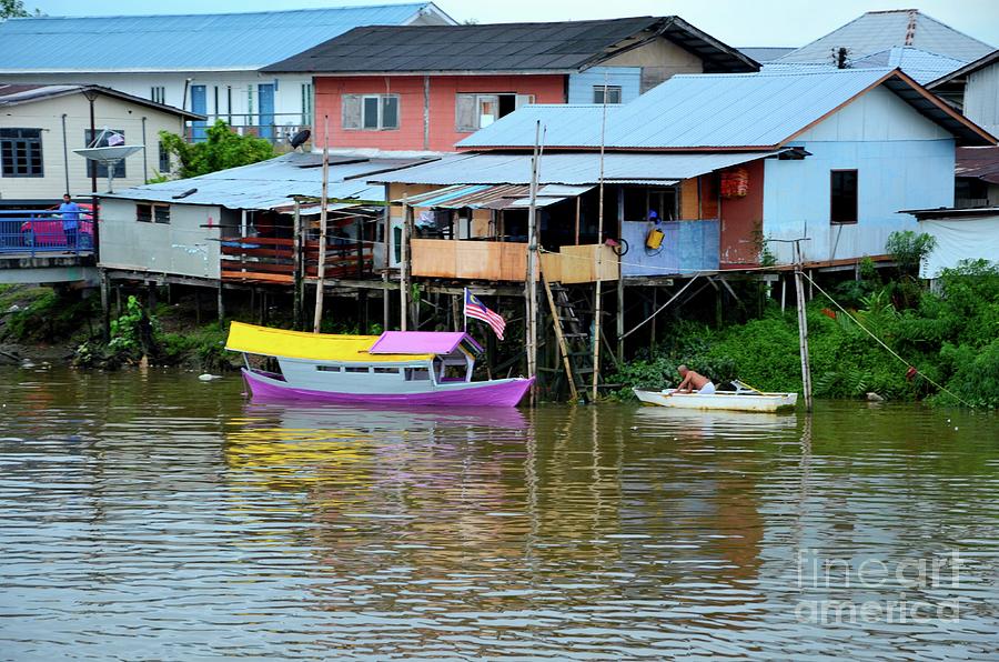 Colorful purple  and yellow boat on Sarawak River by kampong village Kuching Malaysia #2 Photograph by Imran Ahmed