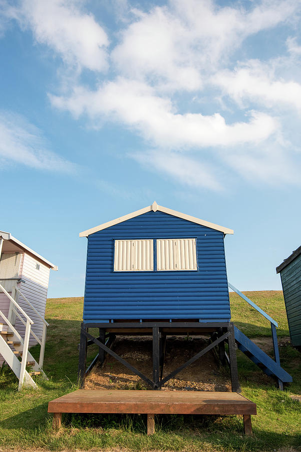Colourful Wooden Beach Huts Facing The Ocean At Whitstable Coast Photograph