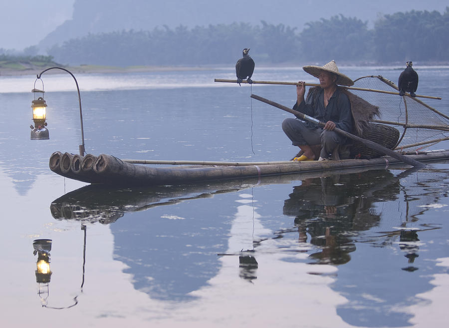 Cormorant fisherman on Li river near Guilin China #1 Photograph by Nancy Brown
