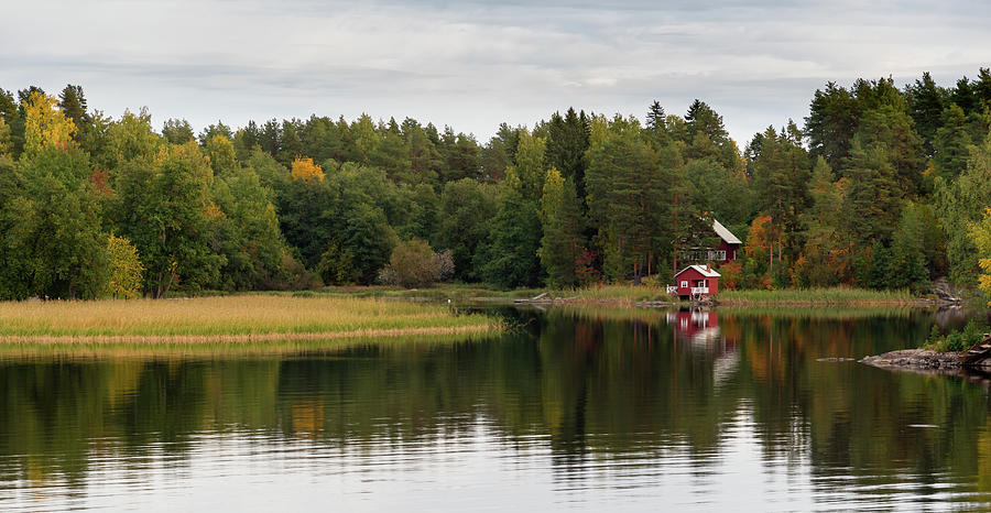 Country house in the forest in the lake. Autumn season Kuopio Finland #1 Photograph by Michalakis Ppalis