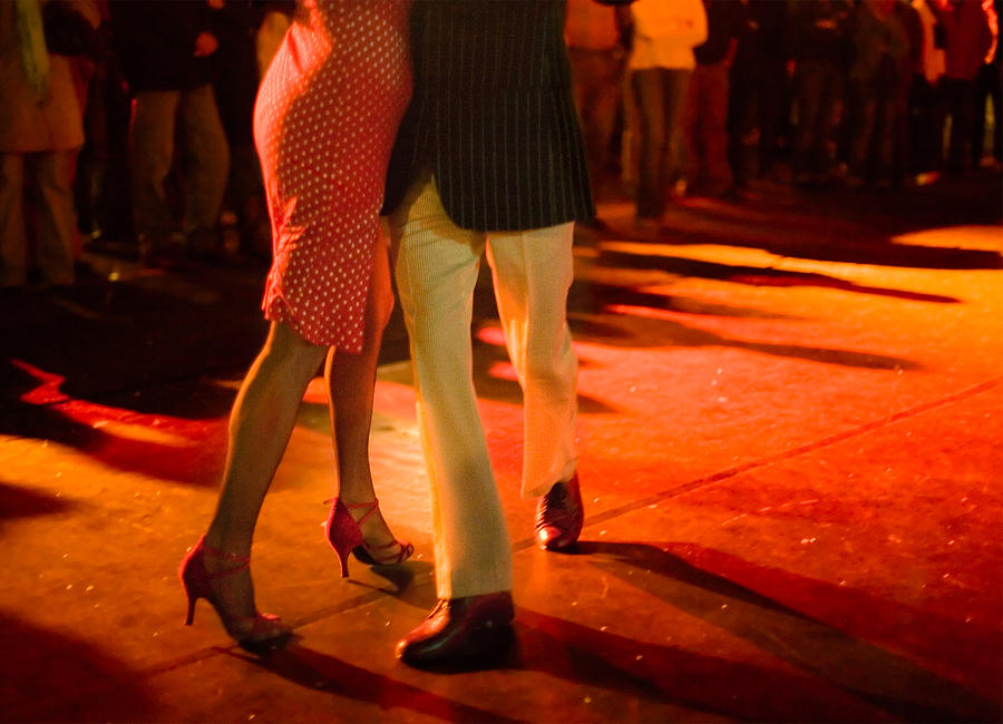 Couple dancing Argentine Tango outdoors at night. #1 Photograph by Elkor