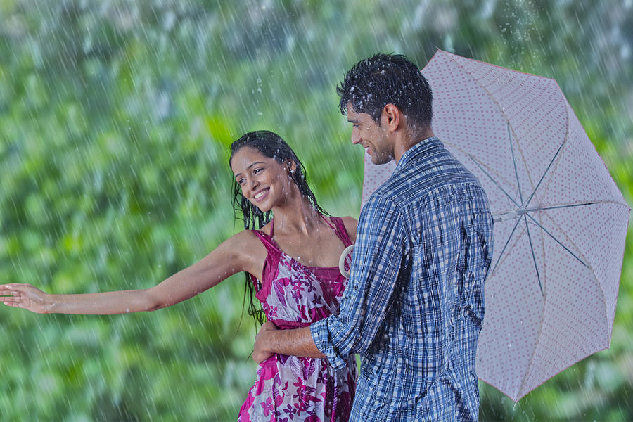 Couple enjoying in the rain #1 Photograph by Abhinandita Mathur 