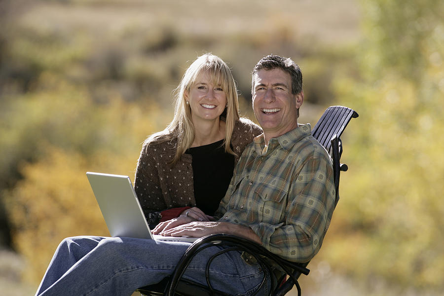 Couple using laptop #1 Photograph by Comstock Images