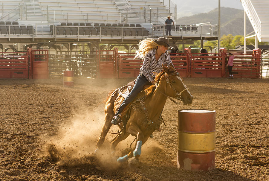 cowgirl cowboy riding horse at rodeo paddock arena at nephi of Salt lake City SLC Utah USA #1 Photograph by Tekinturkdogan
