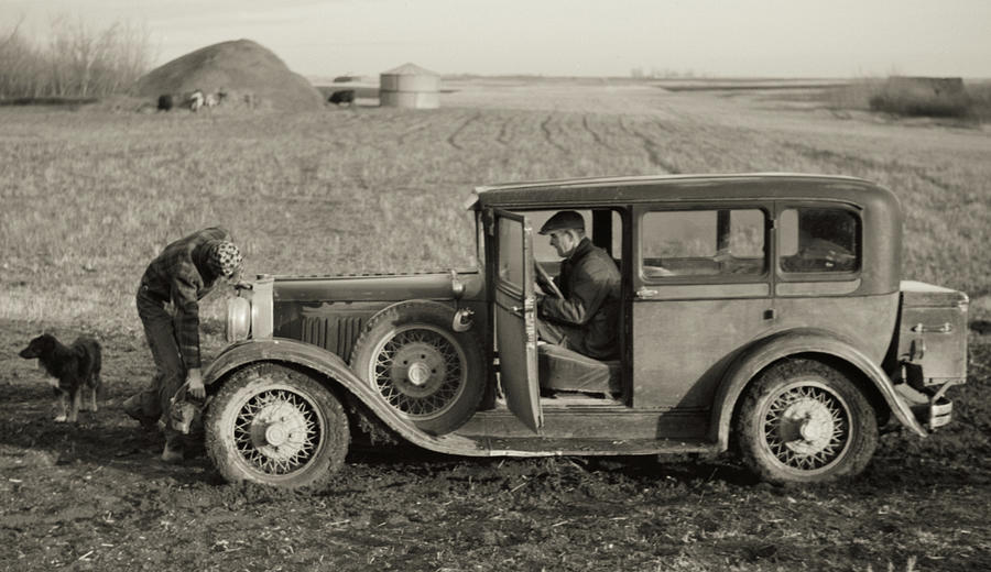 Black And White Photograph - Cranking the Family Car - North Dakota 1940 #1 by John Vachon