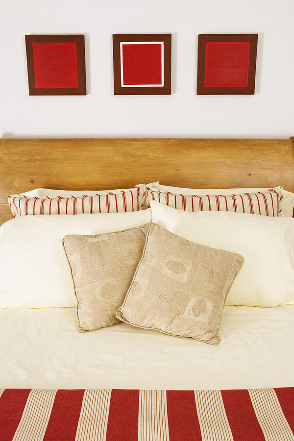 Cushions and pillows on the bed #1 Photograph by Glowimages