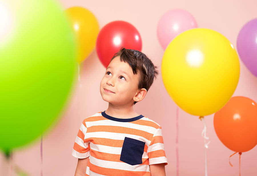 Cute child among colorful balloons. #1 Photograph by Pinstock