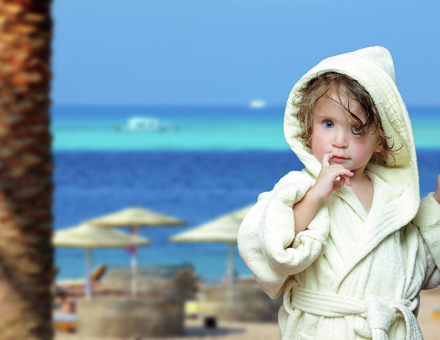 Cute Girl In Bathrobe On Beach #1 Photograph by Mikhail Kokhanchikov