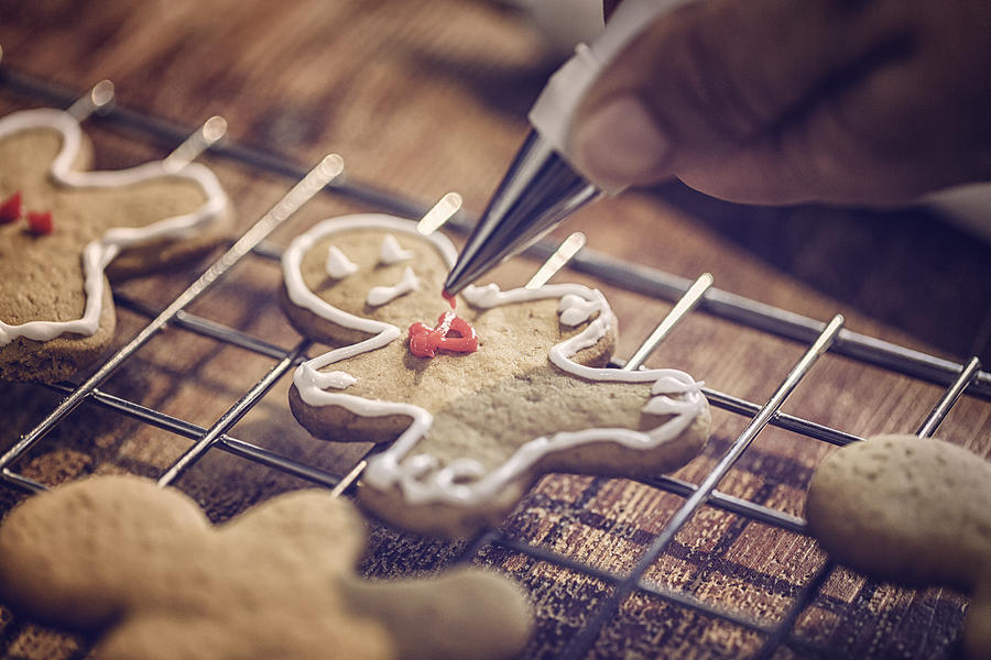 Decorating Christmas Cookies with Icing #1 Photograph by GMVozd