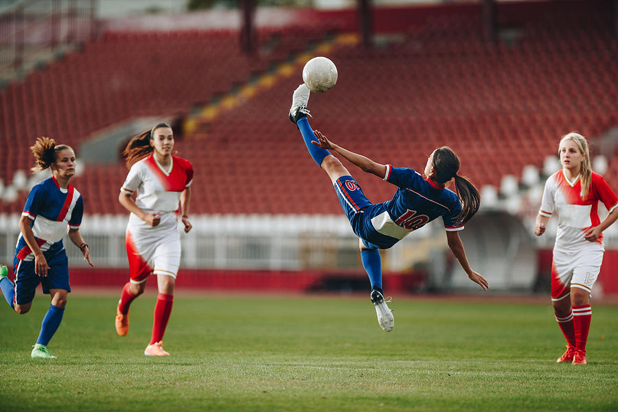Determined bicycle kick on a soccer match! #1 Photograph by Skynesher