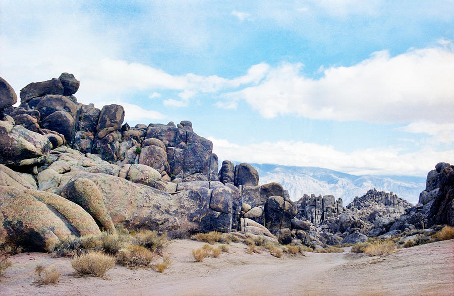 Dirt Road through Alabama Hills Rock Formations #1 Photograph by photo by Pam Susemiehl