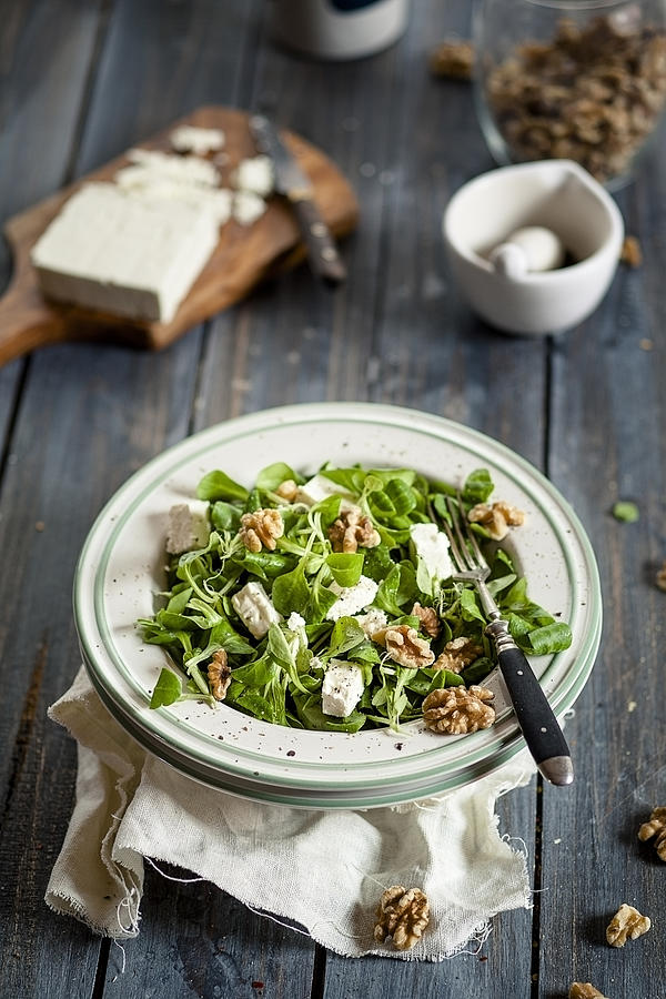 Dish of lambs lettuce, Valerianella locusta, with walnuts and feta #1 Photograph by Westend61