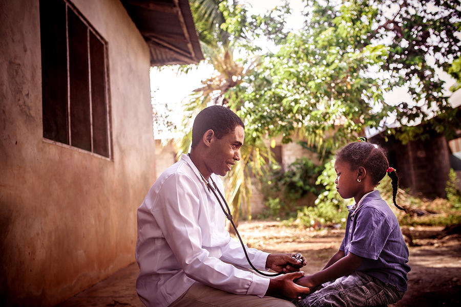 Doctor meet African child #1 Photograph by Zeljkosantrac