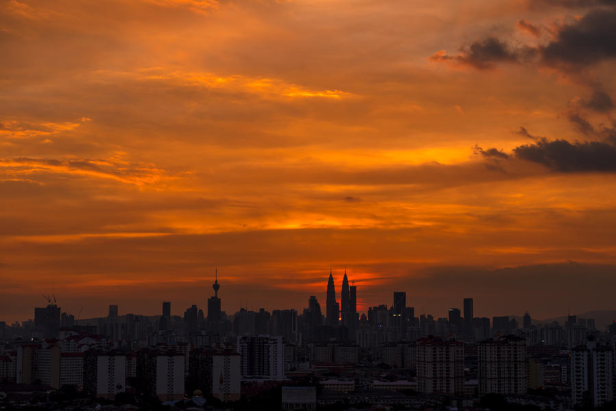 Dramatic sunset in downtown Kuala Lumpur, Malaysia #1 Photograph by Shaifulzamri