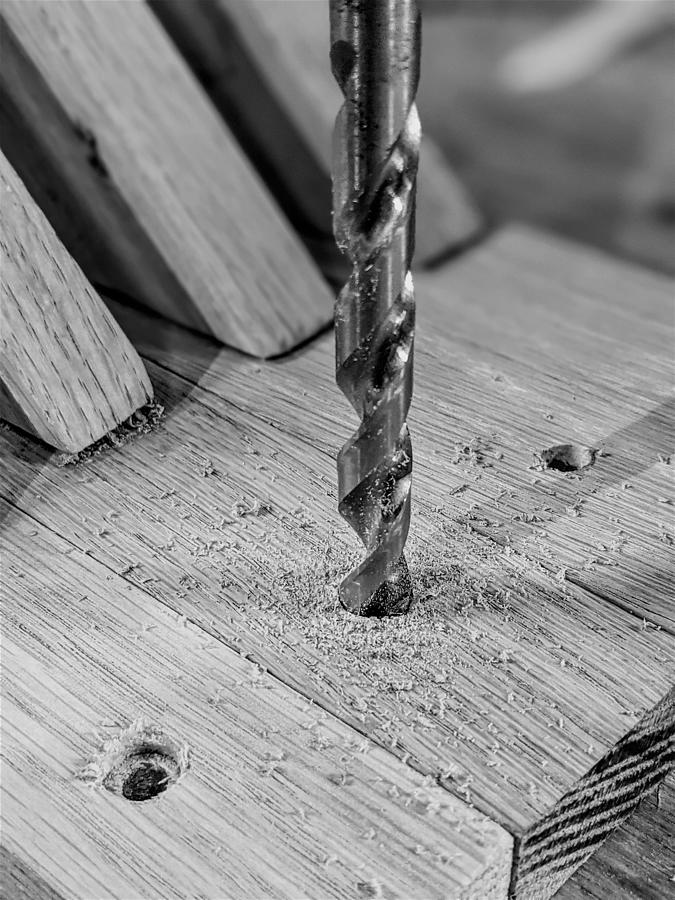 Drilling wooden plank close up #1 Photograph by Alex Grichenko