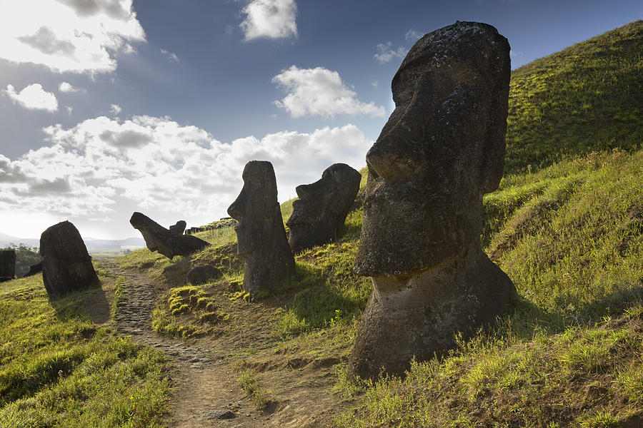 Easter Island, Rano Raraka, ancient Moai statues on hillside #1 Photograph by Michael Dunning