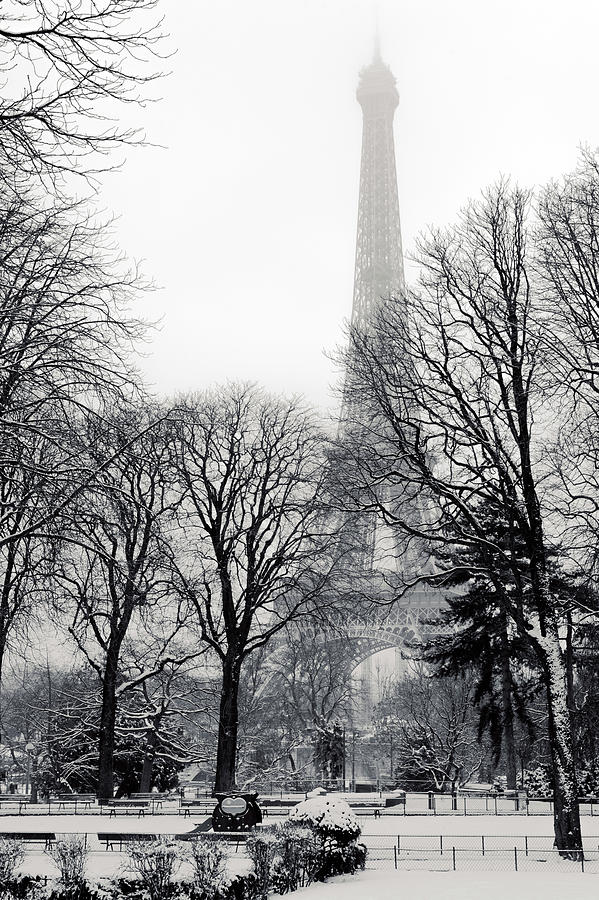 Eiffel tower under the snow in Paris #1 Photograph by Philippe Lejeanvre