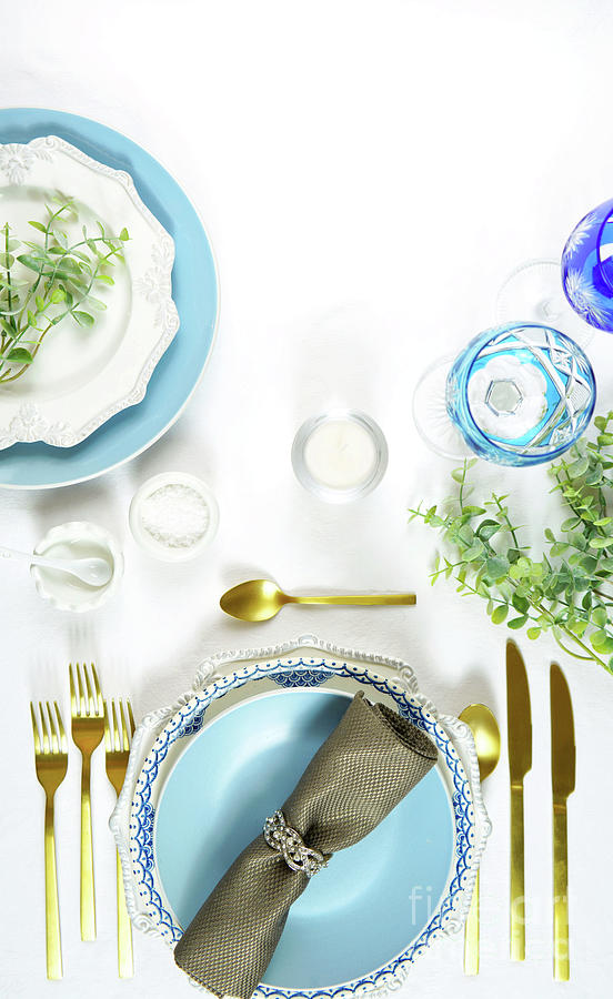 Elegant fine china events table place settings in blue white and gold theme. #1 Photograph by Milleflore Images