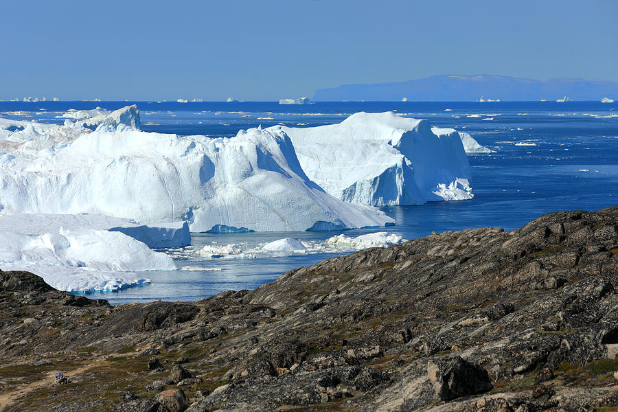 Elevated view from rocky terrain at huge icebergs #1 Photograph by Rainer Grosskopf