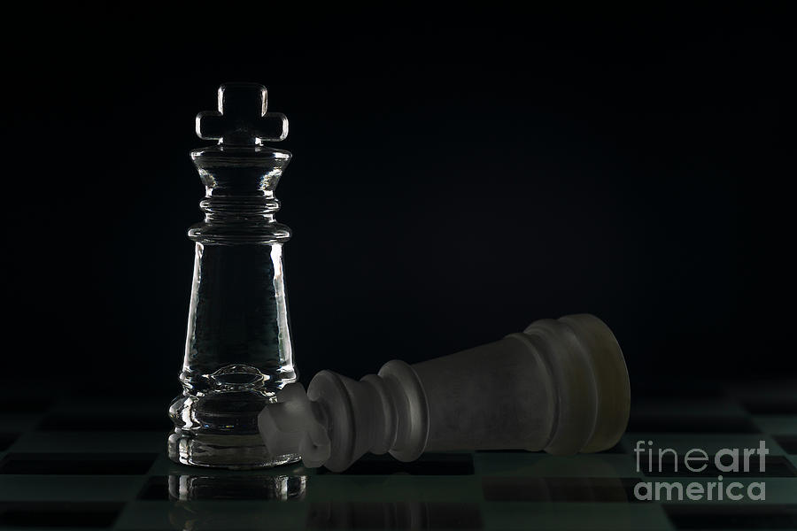 Fallen chess king as a metaphor for fall from power black background copy space macro #1 Photograph by Pablo Avanzini
