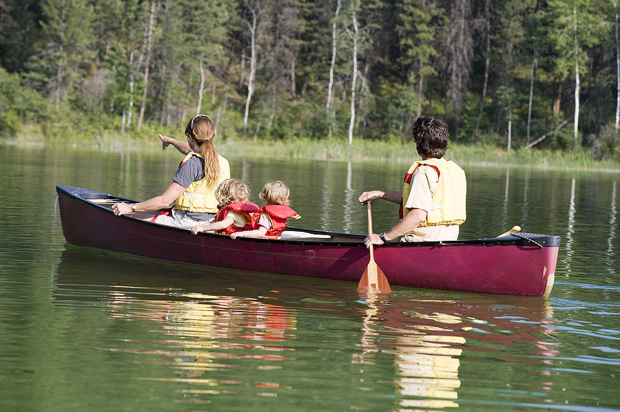 Family canoeing #1 Photograph by Comstock Images
