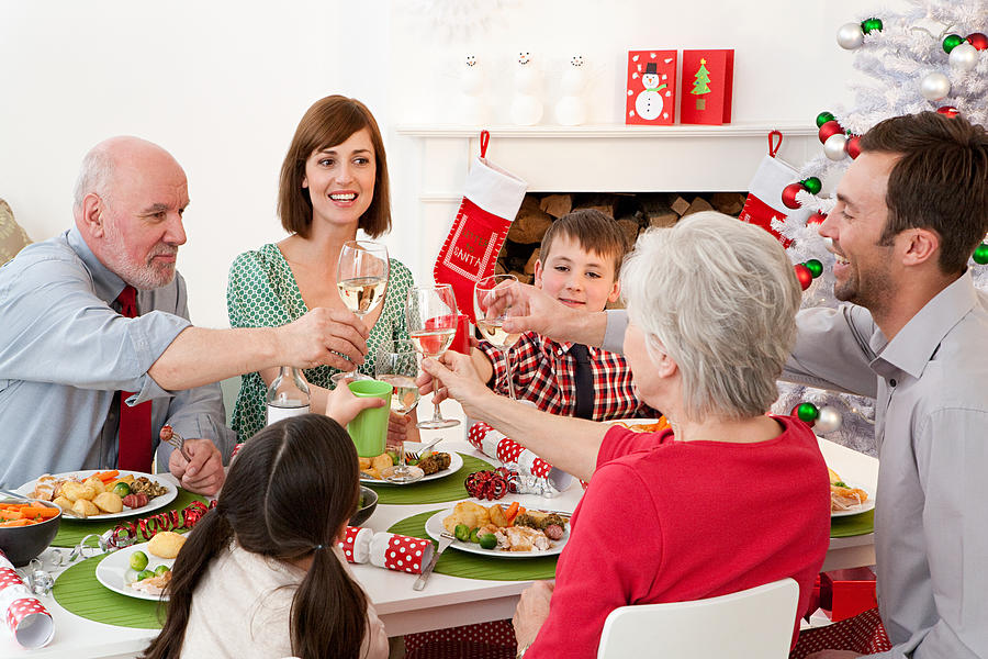 Family enjoying Christmas dinner #1 Photograph by Image Source