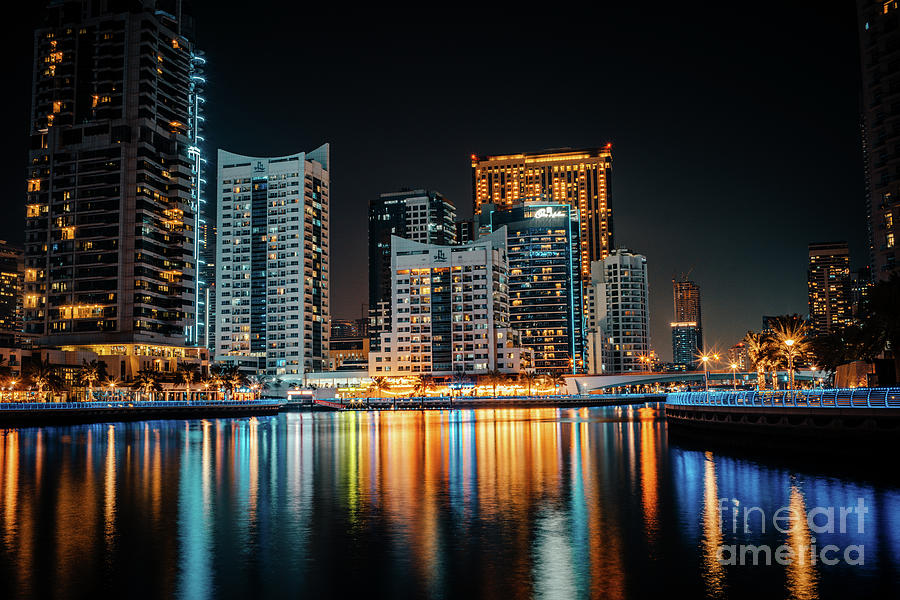 Fantastic nighttime skyline with illuminated skyscrapers. Dubai, UAE #1 Photograph by Raimond Klavins
