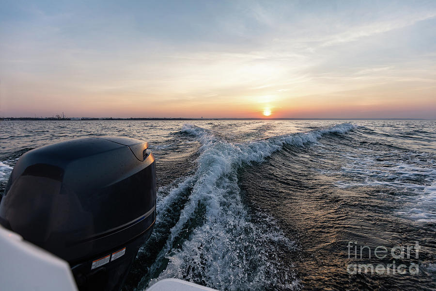 Fast motorboat ride on sea at sunset. #1 Photograph by Michal Bednarek