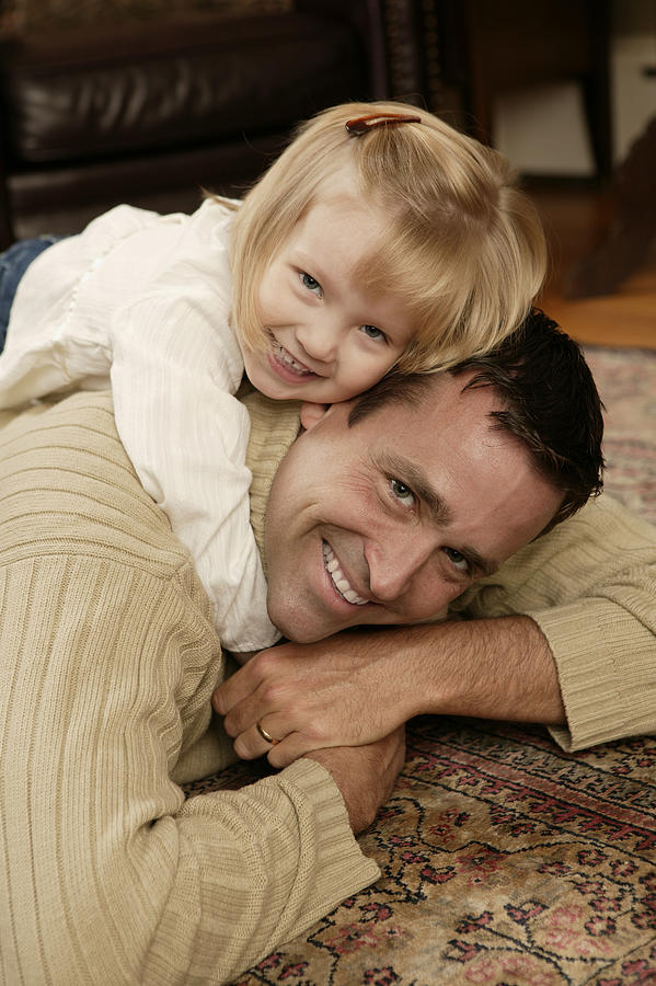Father and daughter playing #1 Photograph by Comstock Images