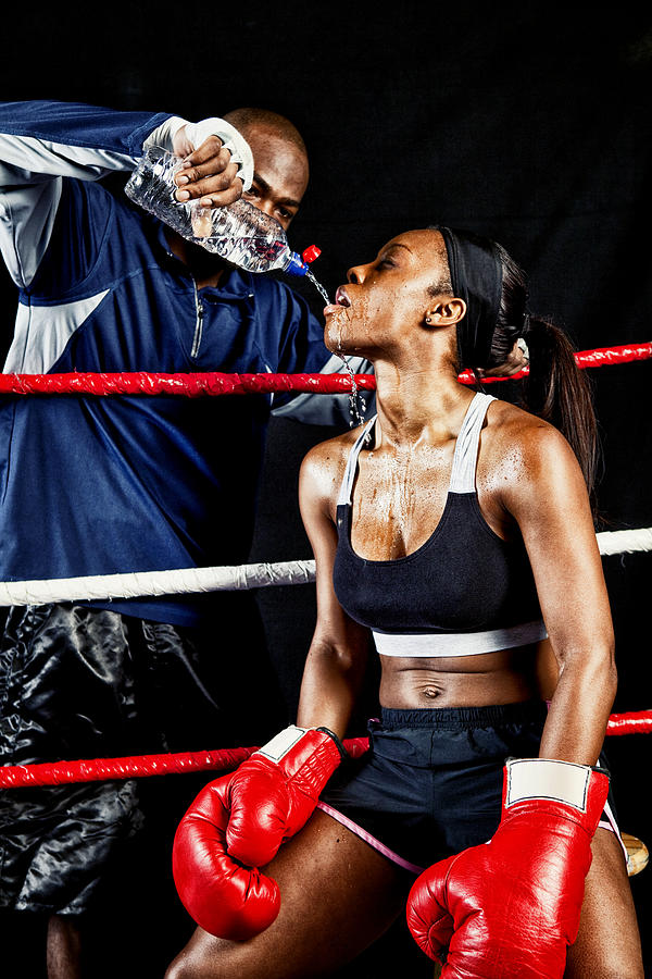 Female Boxer with Coach in the Ring #1 Photograph by Powerofforever