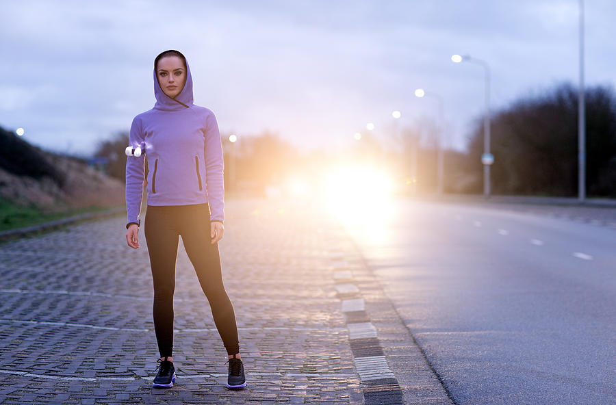Female Jogger At Winter Evening Outdoors #1 Photograph by Lorado