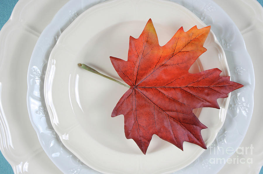 Festive holiday table place setting with maple leaf on fine china close up. #1 Photograph by Milleflore Images