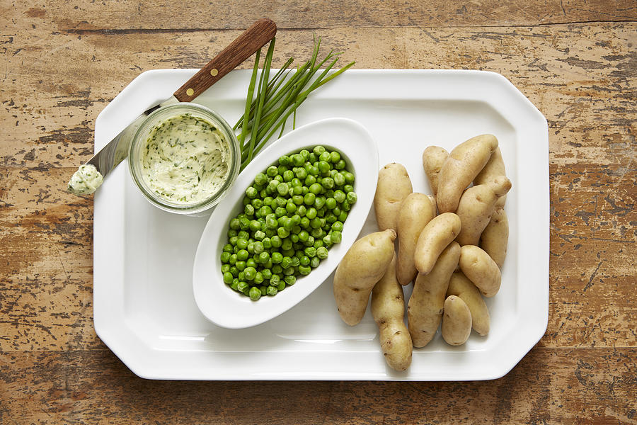 Fingerling potatoes and spring peas served with a chive compound butter Photograph by Ryan Benyi Photography