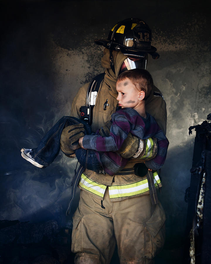 Firefighter Carrying Boy #1 Photograph by Stevecoleimages