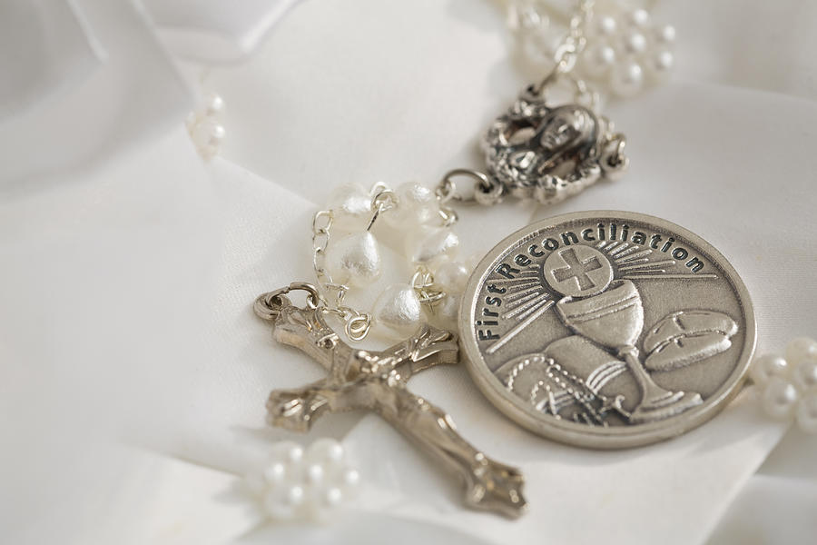 First communion book, rosary beads with silver cross, white religious dress #1 Photograph by Vstock