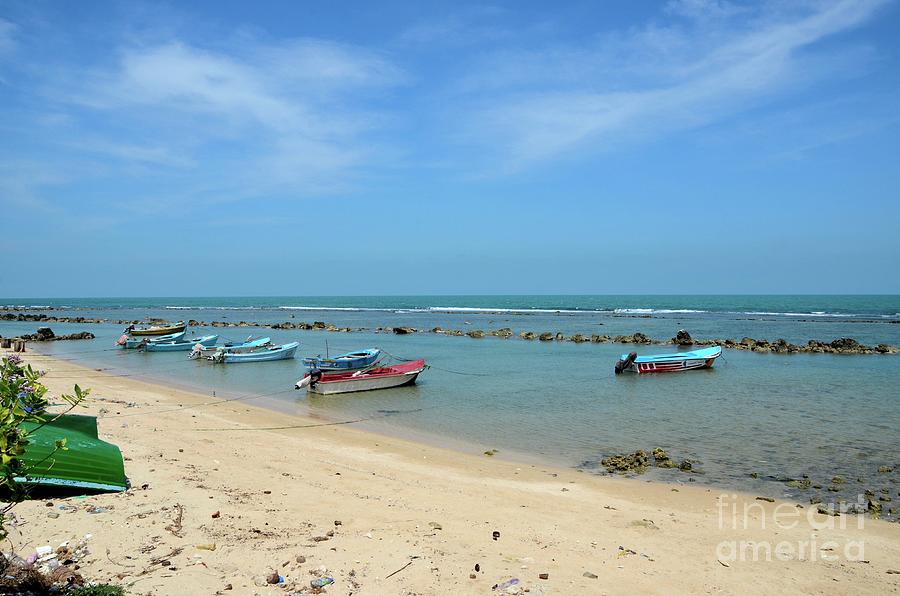 Fishing motor boats parked in shallow water beach Jaffna Peninsula Sri Lanka #2 Photograph by Imran Ahmed