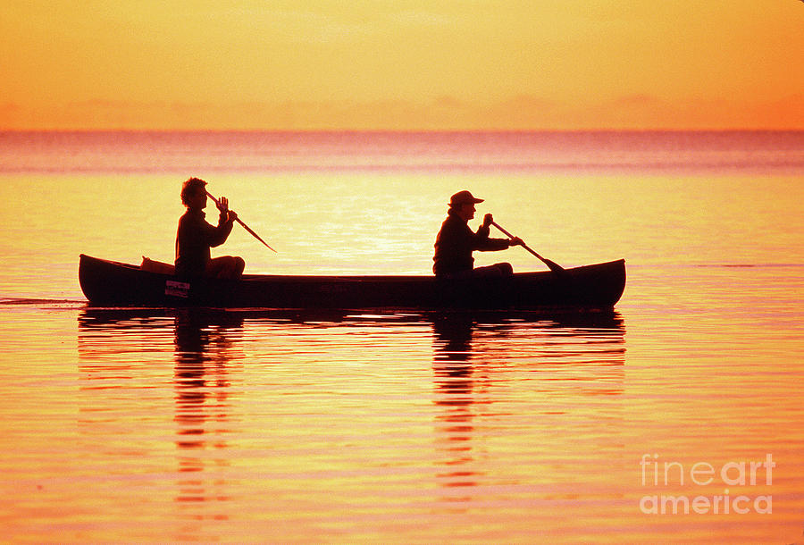 Fishermen Paddeling a Canoe, Everglades National Park Photograph by Wernher Krutein
