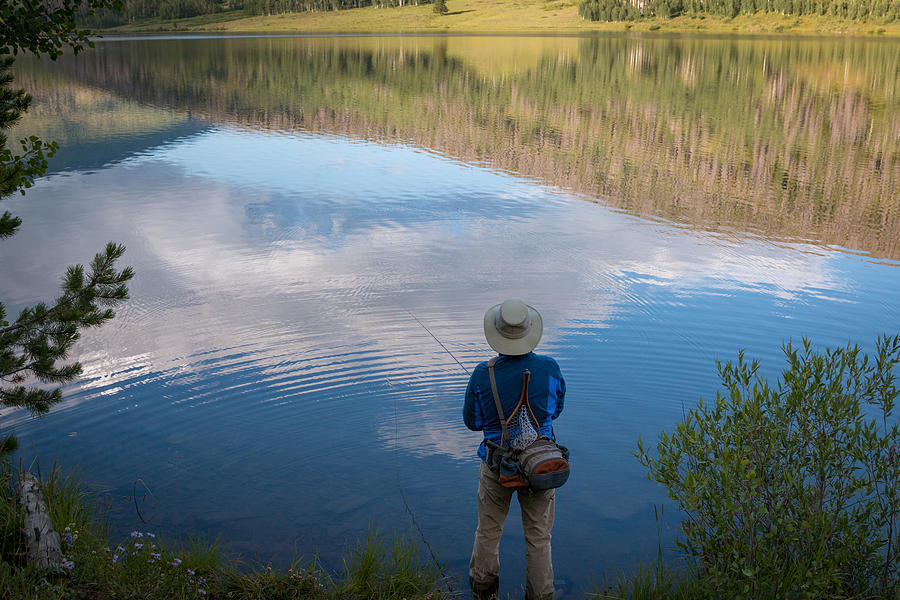 Fly Fisherman At Mountain Lake With Reflections #1 Photograph by Karen Desjardin