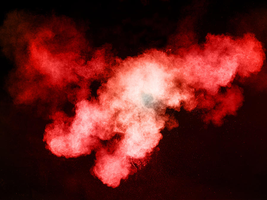 Forms and textures of an explosion of a powder of colors red on a black bottom #1 Photograph by Jose A. Bernat Bacete