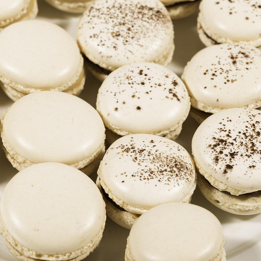 French Macaroons lined up in a dish #1 Photograph by Jean-Marc PAYET