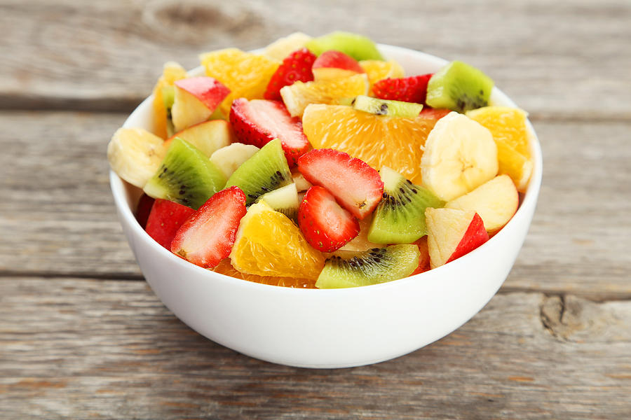 Fresh fruit salad on grey wooden background #1 Photograph by 5second