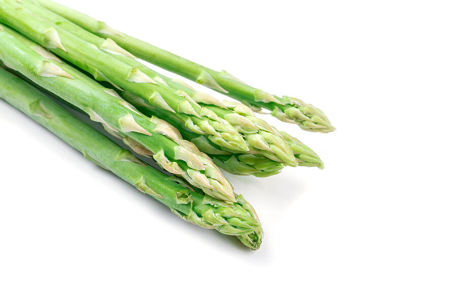 Fresh green asparagus on white #1 Photograph by Aedkais
