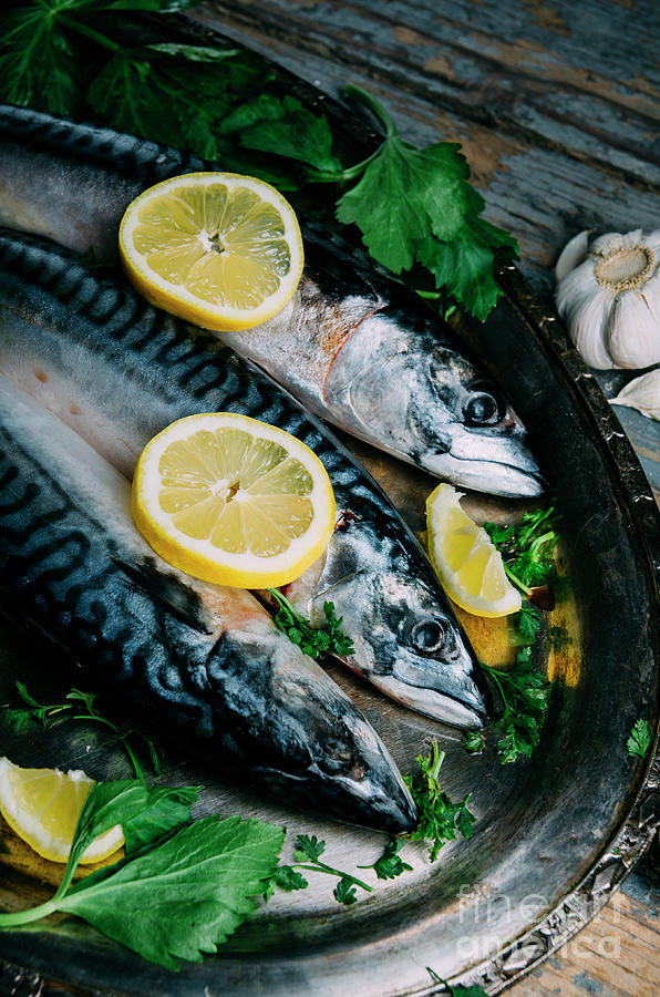 Fresh Mackerel Fish With Lemon And Spices Served On Silver Plate Photograph