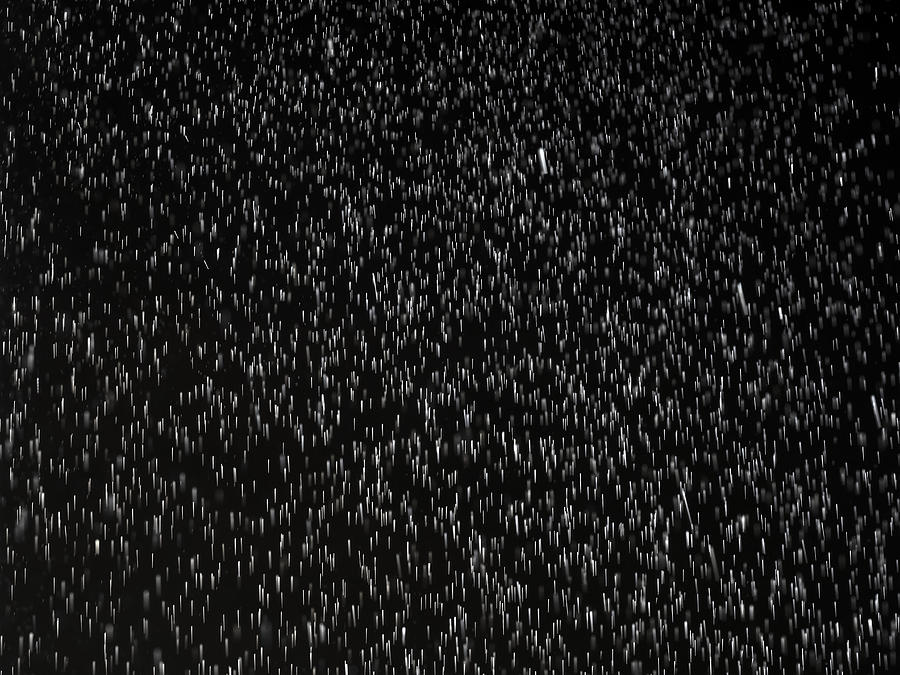 Full frame of Raindrops falling on a black background. #1 Photograph by Jose A. Bernat Bacete