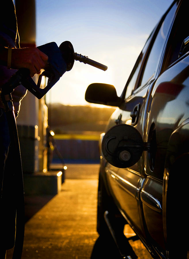 Gas pump filling up a car. #1 Photograph by Stevecoleimages