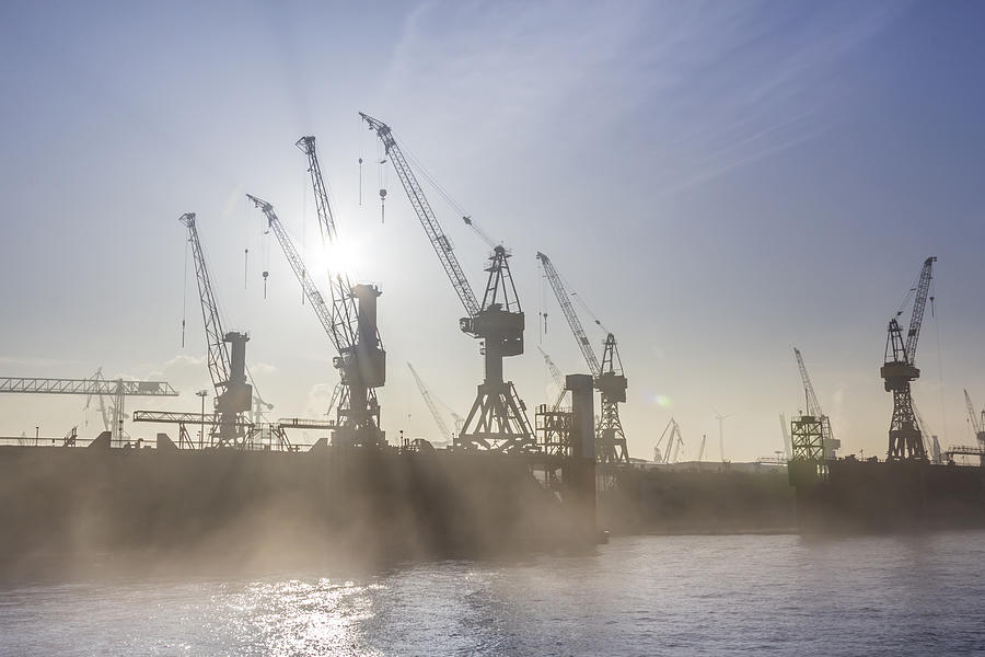 Germany, Hamburg, silhouette of cranes in the fog over the Elbe river #1 Photograph by Westend61