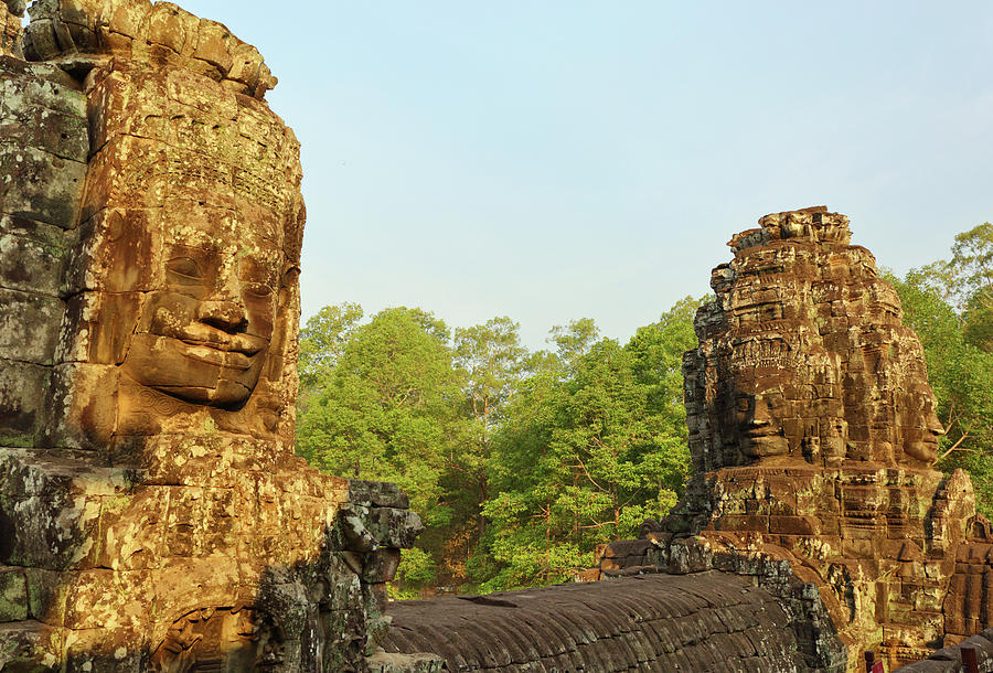 Giant stone faces at Bayon Temple in Cambodia #1 Photograph by Mikhail Kokhanchikov