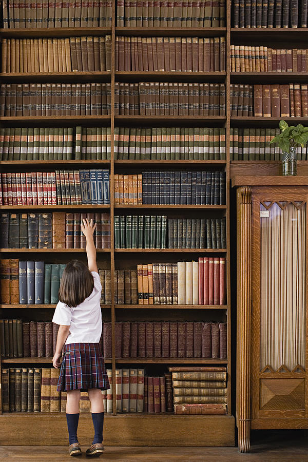 Girl in a library #1 Photograph by Image Source