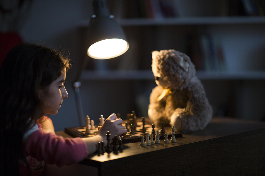 Girl plays chess #1 Photograph by Ridvan_celik