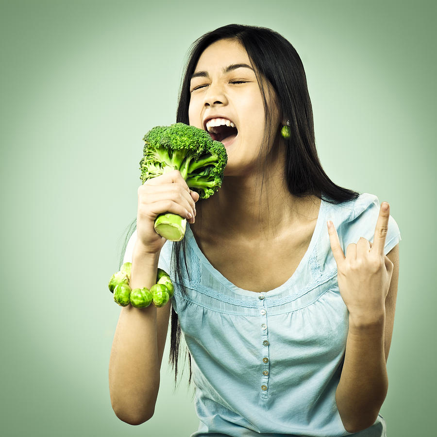 Girl singing in a broccoli microphone #1 Photograph by Eva-Katalin